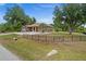 Single story house with a fenced yard and landscaping at 5208 Griggs Ave, North Port, FL 34291