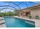 Spacious pool and patio with screened enclosure at 5208 Griggs Ave, North Port, FL 34291