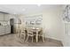 Charming dining area with a farmhouse table and chairs at 5298 Palena Blvd, North Port, FL 34287