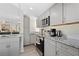 Modern kitchen with gray cabinets and granite countertops at 5298 Palena Blvd, North Port, FL 34287