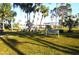 Relaxing park with benches under shady trees at 5298 Palena Blvd, North Port, FL 34287