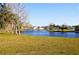 Serene pond with lush landscaping and fountain at 5298 Palena Blvd, North Port, FL 34287