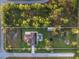 Aerial view of house, pool, and large lot with property lines at 5870 Hornbuckle Blvd, North Port, FL 34291