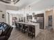 Modern kitchen with stainless steel appliances, quartz countertops, and an island with seating at 5870 Hornbuckle Blvd, North Port, FL 34291