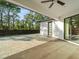 Covered patio with pavers, modern door, and a view of the backyard at 5870 Hornbuckle Blvd, North Port, FL 34291