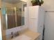 Clean bathroom with a vanity, shower, and linen cabinet at 6815 Amoko Ct, North Port, FL 34287