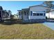 Front view of a single-wide mobile home on a grassy lot at 6815 Amoko Ct, North Port, FL 34287