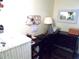 Bright home office with desk, laptop, and wall organizer at 6815 Amoko Ct, North Port, FL 34287