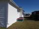 Side view of the mobile home showing AC unit at 6815 Amoko Ct, North Port, FL 34287