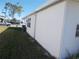 White mobile home exterior with green lawn at 6815 Amoko Ct, North Port, FL 34287