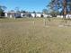 Spacious lot with mobile homes in the background at 6815 Amoko Ct, North Port, FL 34287