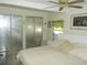 Spacious main bedroom with a king-size bed and ample closet space at 6815 Amoko Ct, North Port, FL 34287