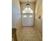 Bright entryway with double doors and tile flooring at 699 Monaco Dr, Punta Gorda, FL 33950