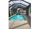 Relaxing screened pool and spa area with a hot tub at 699 Monaco Dr, Punta Gorda, FL 33950