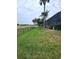 Landscaped yard with golf course view at 699 Monaco Dr, Punta Gorda, FL 33950