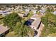 Aerial view showing home, pool, and neighborhood at 701 Coral Way, Englewood, FL 34223