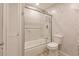 Clean bathroom featuring a bathtub and sliding glass door at 701 Coral Way, Englewood, FL 34223