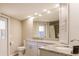 Updated bathroom with granite countertops and a large mirror at 701 Coral Way, Englewood, FL 34223