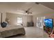 Main bedroom with a large TV and access to the pool at 701 Coral Way, Englewood, FL 34223