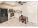 Small kitchenette with black appliances and table at 701 Coral Way, Englewood, FL 34223