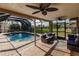 Inviting pool area with screened patio and lounge seating at 701 Coral Way, Englewood, FL 34223