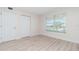 Bedroom with double door closet and window blinds at 101 N. Marion Court # 222, Punta Gorda, FL 33950