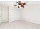 Bright bedroom with ceiling fan and double door closet at 101 N. Marion Court # 222, Punta Gorda, FL 33950