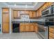 Modern kitchen with wood cabinets, granite countertops and appliances at 101 N. Marion Court # 222, Punta Gorda, FL 33950