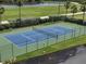 Community tennis court with green and blue surface at 101 N. Marion Court # 222, Punta Gorda, FL 33950