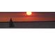 Silhouetted sailboat at sunset on calm water at 101 N. Marion Court # 222, Punta Gorda, FL 33950