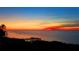 Bright sunset over calm water with pier at 101 N. Marion Court # 222, Punta Gorda, FL 33950