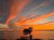 Orange and pink sunset over calm water at 101 N. Marion Court # 222, Punta Gorda, FL 33950