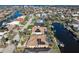 Bird's eye view of house, pool, and canal, showcasing solar panels at 1131 Via Tripoli, Punta Gorda, FL 33950