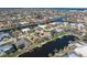 Aerial view of canal-front home with pool and solar panels at 1131 Via Tripoli, Punta Gorda, FL 33950