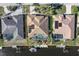 Aerial view showcasing a canal-front home, pool, and solar panels at 1131 Via Tripoli, Punta Gorda, FL 33950