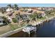 Aerial view of single Gathering home with private pool and canal access at 1131 Via Tripoli, Punta Gorda, FL 33950