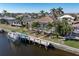 Waterfront property showcasing a pool, dock and boat at 1131 Via Tripoli, Punta Gorda, FL 33950