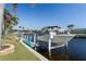 Private boat dock with lift in a desirable waterfront community at 1131 Via Tripoli, Punta Gorda, FL 33950