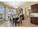 Bright dining room with water views and adjacent kitchen access at 1131 Via Tripoli, Punta Gorda, FL 33950