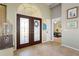 Bright and spacious entryway with double doors and decorative accents at 1131 Via Tripoli, Punta Gorda, FL 33950