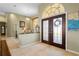 View of entryway with double doors, and glimpse of adjacent room at 1131 Via Tripoli, Punta Gorda, FL 33950