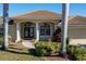 House exterior with columns, double doors and lush landscaping at 1131 Via Tripoli, Punta Gorda, FL 33950