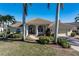 Single-story home with tile roof, two-car garage, and landscaped yard at 1131 Via Tripoli, Punta Gorda, FL 33950