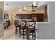 Kitchen with an island, dark wood cabinets, and stainless steel appliances at 1131 Via Tripoli, Punta Gorda, FL 33950