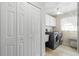 Laundry room with washer, dryer, and storage cabinets at 1131 Via Tripoli, Punta Gorda, FL 33950
