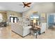 Bright living room with vaulted ceilings, tile floors, and comfy seating at 1131 Via Tripoli, Punta Gorda, FL 33950
