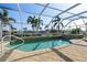 Inviting screened-in pool and spa with water views at 1131 Via Tripoli, Punta Gorda, FL 33950
