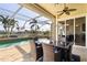 Enclosed patio with pool, canal views, and seating at 1131 Via Tripoli, Punta Gorda, FL 33950