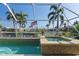 Relaxing pool and spa with screened enclosure and scenic canal views at 1131 Via Tripoli, Punta Gorda, FL 33950