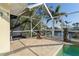 Spacious poolside patio with seating area and screened enclosure at 1131 Via Tripoli, Punta Gorda, FL 33950